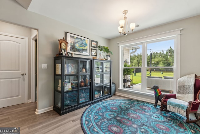 102 Bowline Ln, Kingsland, GA 31548 - sitting room with a chandelier, wood finished floors, and baseboards
