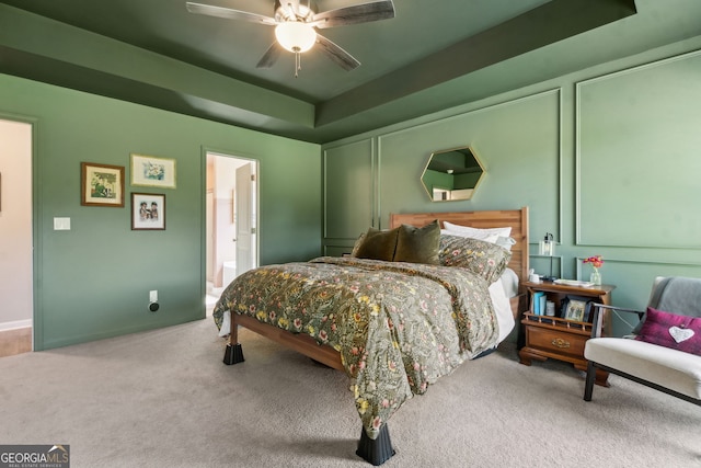 102 Bowline Ln, Kingsland, GA 31548 - bedroom featuring carpet, a tray ceiling, ceiling fan, and ensuite bath