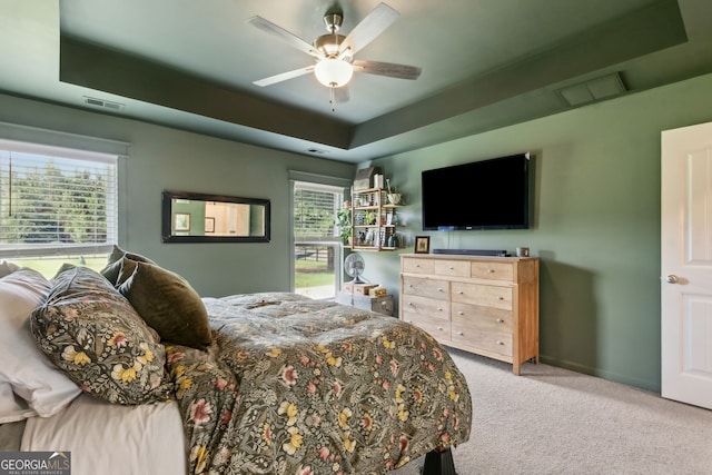 102 Bowline Ln, Kingsland, GA 31548 - carpeted bedroom with a tray ceiling, ceiling fan, and baseboards