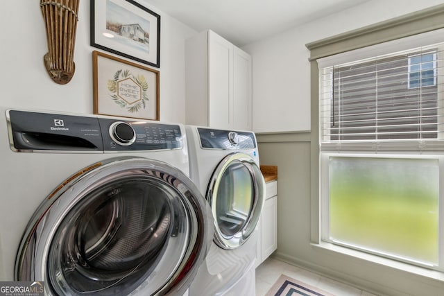 102 Bowline Ln, Kingsland, GA 31548 - washroom with washing machine and clothes dryer, cabinet space, and light tile patterned floors