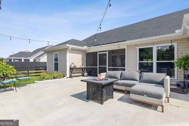 102 Bowline Ln, Kingsland, GA 31548 - view of patio / terrace featuring a sunroom, a ceiling fan, and an outdoor living space with a fire pit