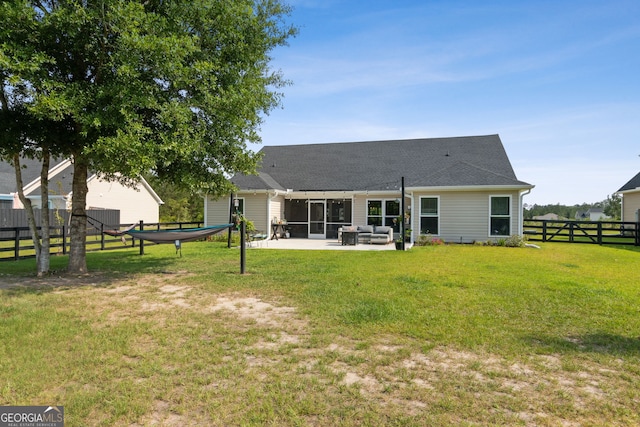 102 Bowline Ln, Kingsland, GA 31548 - back of house with an outdoor living space, a patio, and a shingled roof
