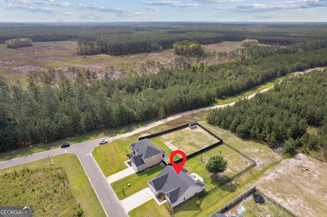 102 Bowline Ln, Kingsland, GA 31548 - aerial view of property and surrounding area featuring a heavily wooded area