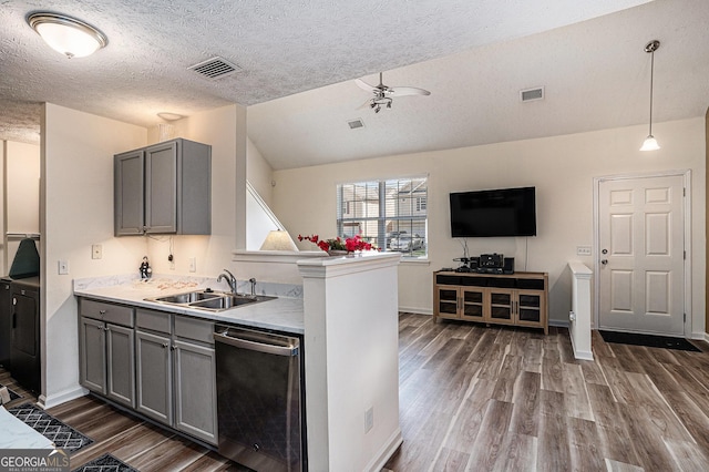 855 Lakeside Cir, Covington, GA 30016 - kitchen with dishwasher, gray cabinetry, a sink, dark wood-type flooring, and a textured ceiling