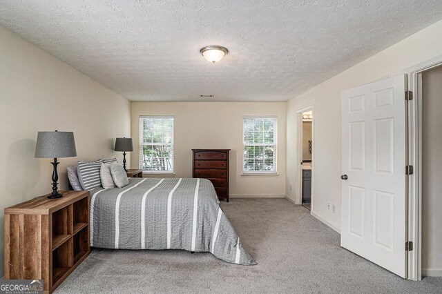 855 Lakeside Cir, Covington, GA 30016 - bedroom featuring light carpet, baseboards, and a textured ceiling