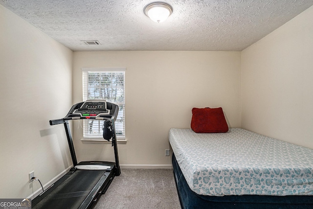 855 Lakeside Cir, Covington, GA 30016 - bedroom with carpet floors, baseboards, and a textured ceiling