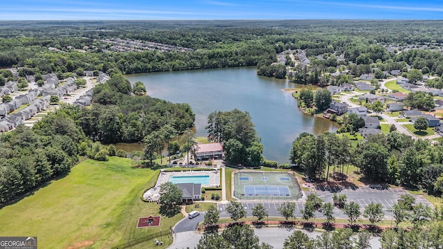 855 Lakeside Cir, Covington, GA 30016 - drone / aerial view of a heavily wooded area, a nearby body of water, and a pool area