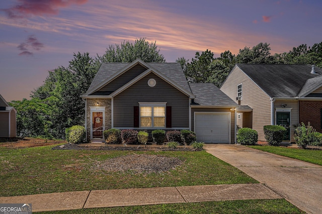 855 Lakeside Cir, Covington, GA 30016 - traditional-style house with driveway, an attached garage, and a yard