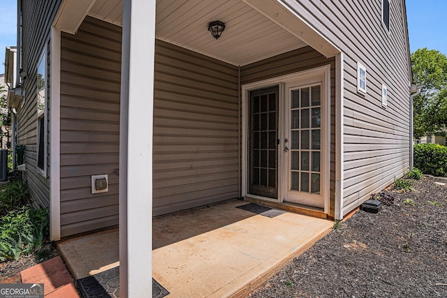 855 Lakeside Cir, Covington, GA 30016 - entrance to property with a patio and central AC