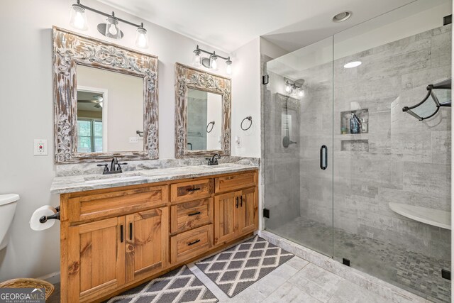 751 Hawkins Rd, Homer, GA 30547 - full bathroom with toilet, double vanity, and a shower stall
