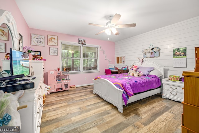 751 Hawkins Rd, Homer, GA 30547 - bedroom featuring light wood-style flooring, ceiling fan, and wood walls