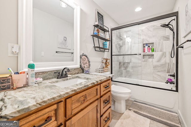 751 Hawkins Rd, Homer, GA 30547 - bathroom with vanity, toilet, enclosed tub / shower combo, and recessed lighting