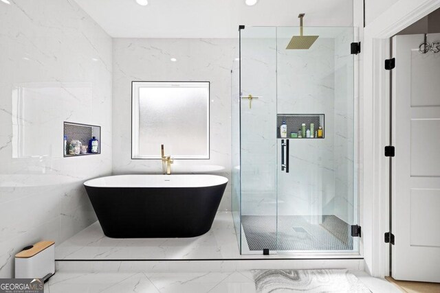 29 Cedar Blf, Winder, GA 30680 - full bathroom featuring a marble finish shower, marble tiled floors, and a freestanding bath