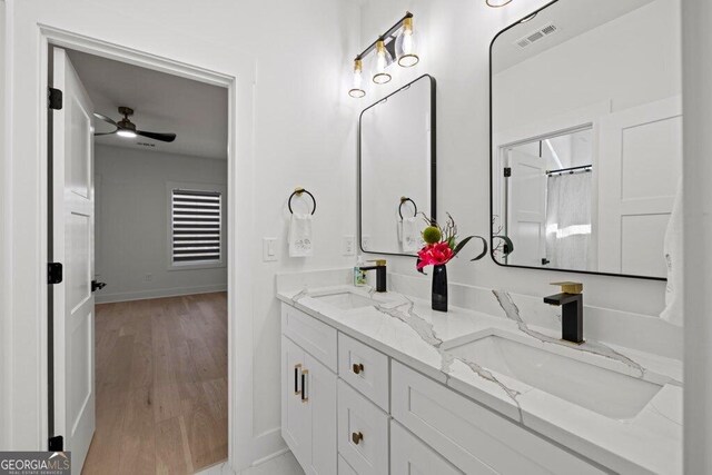 29 Cedar Blf, Winder, GA 30680 - full bathroom with double vanity, ceiling fan, and wood finished floors