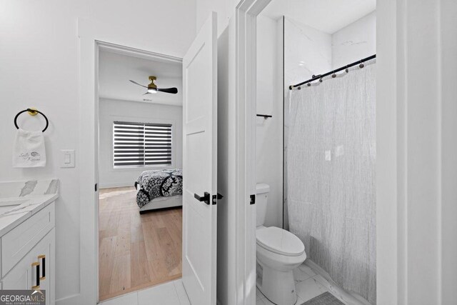29 Cedar Blf, Winder, GA 30680 - bathroom featuring a ceiling fan, ensuite bathroom, vanity, and a shower with curtain
