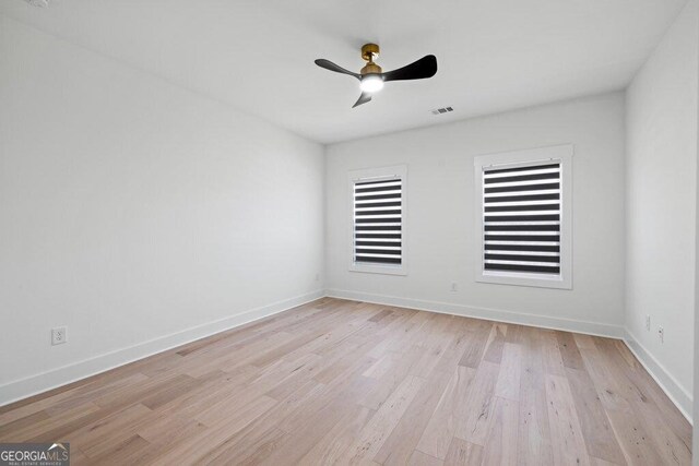 29 Cedar Blf, Winder, GA 30680 - spare room featuring light wood-style flooring and ceiling fan