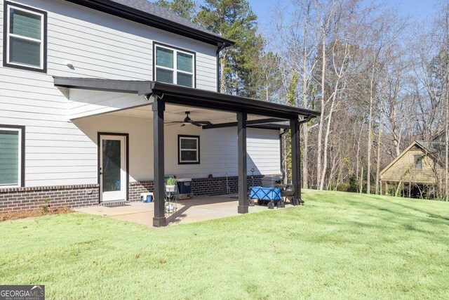 29 Cedar Blf, Winder, GA 30680 - back of house with a patio area, ceiling fan, and a yard