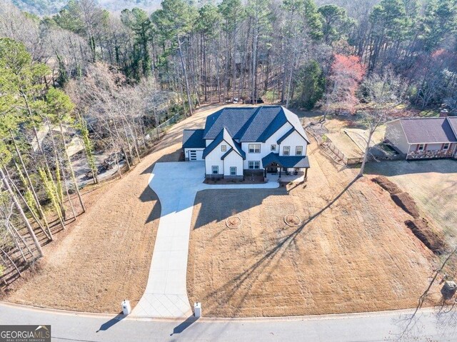 29 Cedar Blf, Winder, GA 30680 - aerial view of property and surrounding area featuring a heavily wooded area