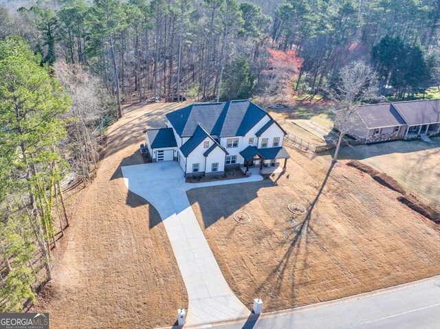 29 Cedar Blf, Winder, GA 30680 - aerial view of property and surrounding area featuring a heavily wooded area