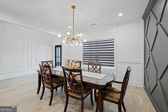 29 Cedar Blf, Winder, GA 30680 - dining area with a decorative wall, a chandelier, ornamental molding, light wood-type flooring, and recessed lighting