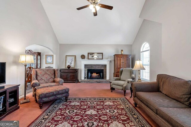 239 Taylors Farm Dr, Canton, GA 30115 - living area featuring carpet, a ceiling fan, high vaulted ceiling, a stone fireplace, and arched walkways