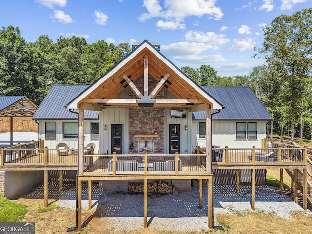 795 E Jones Chapel Rd, Danielsville, GA 30633 - view of front of home featuring a deck, a metal roof, and board and batten siding