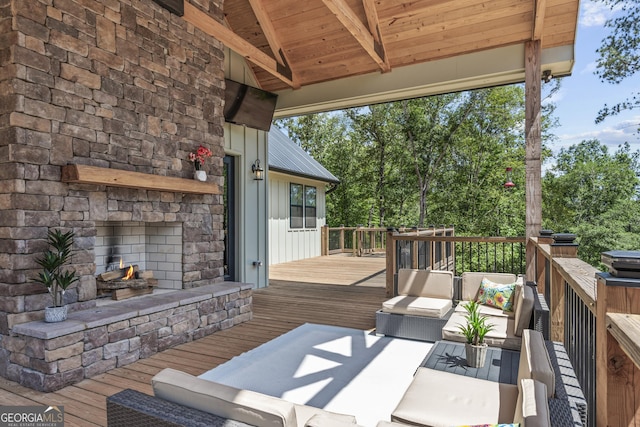 795 E Jones Chapel Rd, Danielsville, GA 30633 - wooden deck with an outdoor living space with a fireplace and view of wooded area
