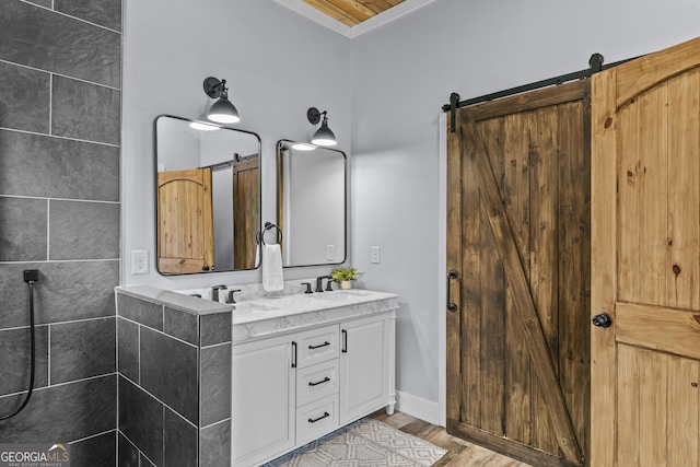 795 E Jones Chapel Rd, Danielsville, GA 30633 - bathroom featuring double vanity and wood finished floors