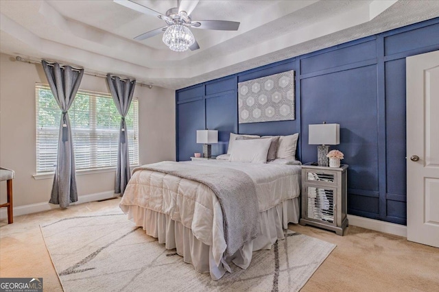 4348 Tillage Path, Douglasville, GA 30135 - bedroom with light carpet, a tray ceiling, baseboards, and a ceiling fan