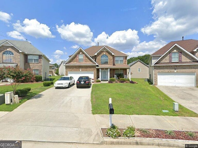 718 Florigen Ln, Fairburn, GA 30213 - view of front of home with driveway, an attached garage, and a front yard