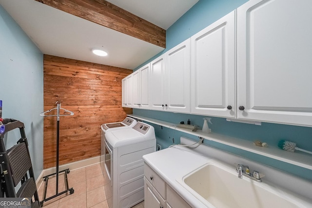 168 Observation Pt, Dallas, GA 30132 - laundry area with wood walls, cabinet space, separate washer and dryer, and light tile patterned flooring