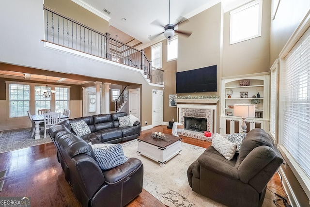 168 Observation Pt, Dallas, GA 30132 - living area with stairs, wood finished floors, ceiling fan, a high ceiling, and a chandelier