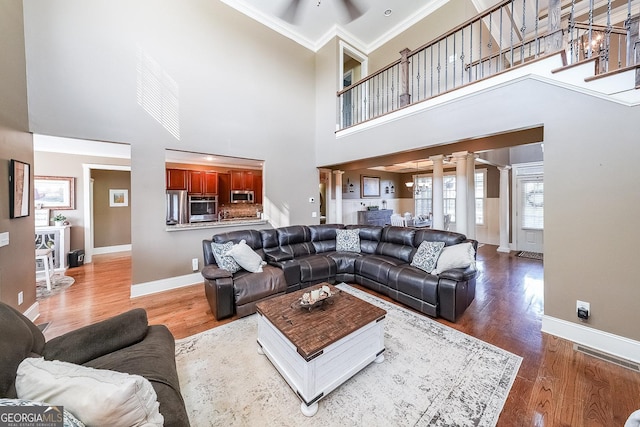 168 Observation Pt, Dallas, GA 30132 - living area with ornamental molding, baseboards, decorative columns, a ceiling fan, and wood finished floors