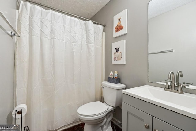 11529 Vinea Ln, Hampton, GA 30228 - bathroom featuring a textured ceiling, toilet, and vanity