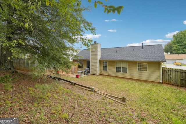 11529 Vinea Ln, Hampton, GA 30228 - back of property with a chimney and a shingled roof