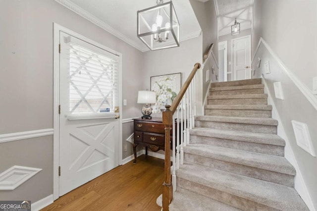 4205 Jeri Lynn Ct, Tucker, GA 30084 - foyer entrance featuring stairway, wood finished floors, a chandelier, and crown molding