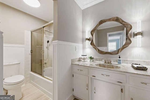4205 Jeri Lynn Ct, Tucker, GA 30084 - full bath featuring vanity, toilet, ornamental molding, wainscoting, and shower / bath combination with glass door