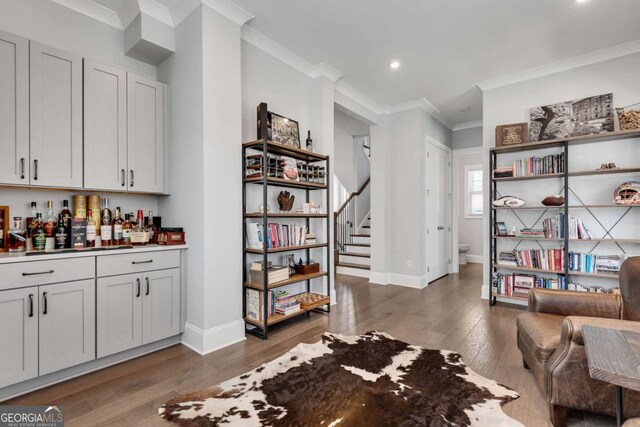 3108 Huntington Pl, Milton, GA 30004 - indoor dry bar featuring crown molding, wood finished floors, baseboards, stairs, and recessed lighting