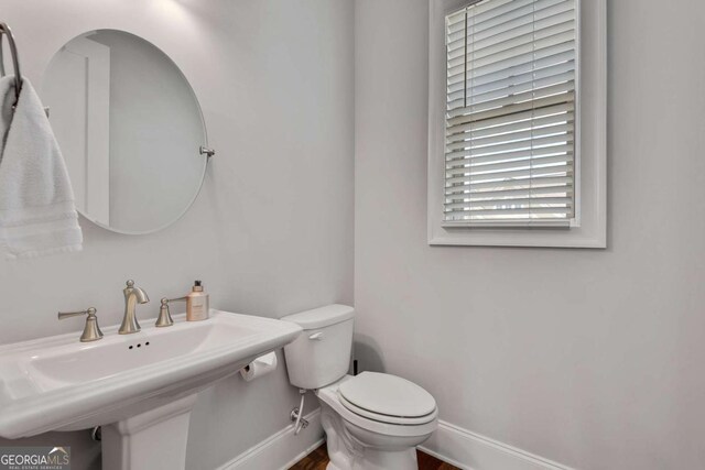 3108 Huntington Pl, Milton, GA 30004 - bathroom with baseboards, toilet, a sink, and wood finished floors