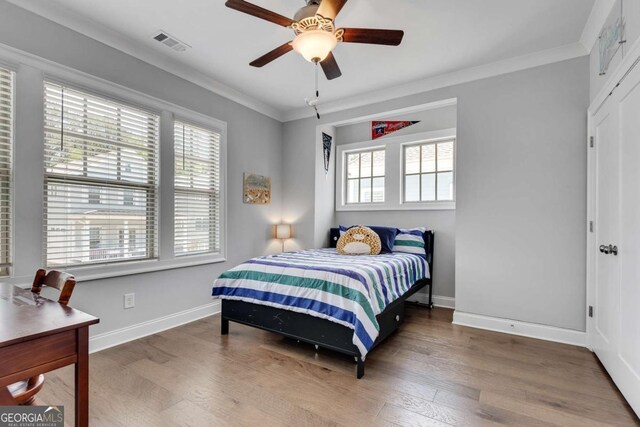 3108 Huntington Pl, Milton, GA 30004 - bedroom featuring wood finished floors, baseboards, crown molding, and ceiling fan
