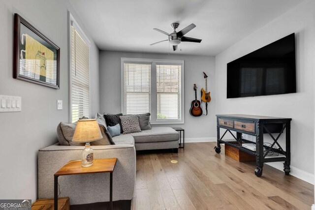 3108 Huntington Pl, Milton, GA 30004 - living room featuring a ceiling fan, baseboards, and wood finished floors