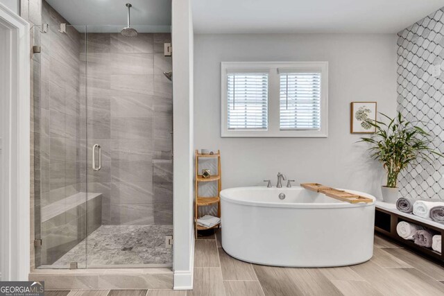 3108 Huntington Pl, Milton, GA 30004 - bathroom featuring a freestanding bath and a shower stall