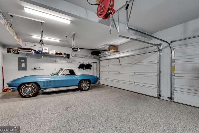 3108 Huntington Pl, Milton, GA 30004 - garage featuring electric panel and a garage door opener
