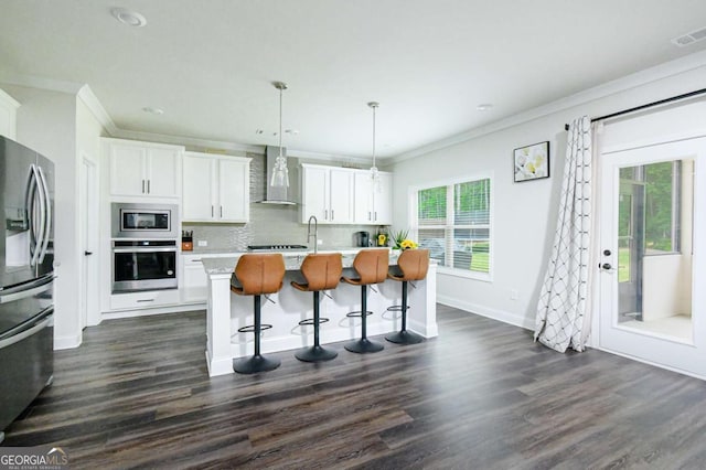 282 Brant Cir, Jefferson, GA 30549 - kitchen featuring stainless steel appliances, wall chimney exhaust hood, crown molding, dark wood-type flooring, and light countertops
