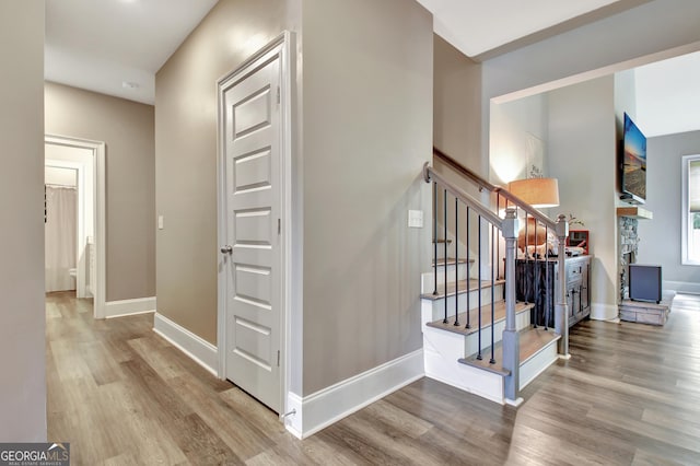 234 Thyme Leaf Way, Locust Grove, GA 30248 - hall with wood finished floors, stairway, and baseboards