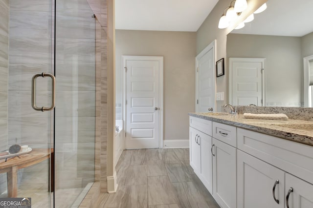 234 Thyme Leaf Way, Locust Grove, GA 30248 - bathroom featuring double vanity, a stall shower, and baseboards