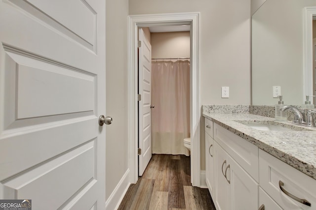 234 Thyme Leaf Way, Locust Grove, GA 30248 - bathroom featuring toilet, vanity, wood finished floors, and a shower with shower curtain