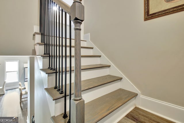 234 Thyme Leaf Way, Locust Grove, GA 30248 - staircase with wood finished floors and baseboards