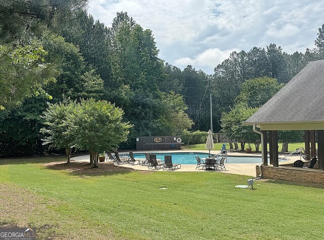 234 Thyme Leaf Way, Locust Grove, GA 30248 - community pool featuring a patio area