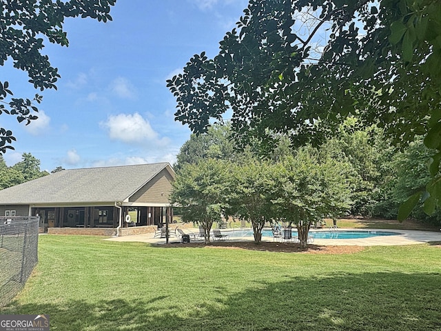 234 Thyme Leaf Way, Locust Grove, GA 30248 - back of property featuring an outdoor pool and a patio area